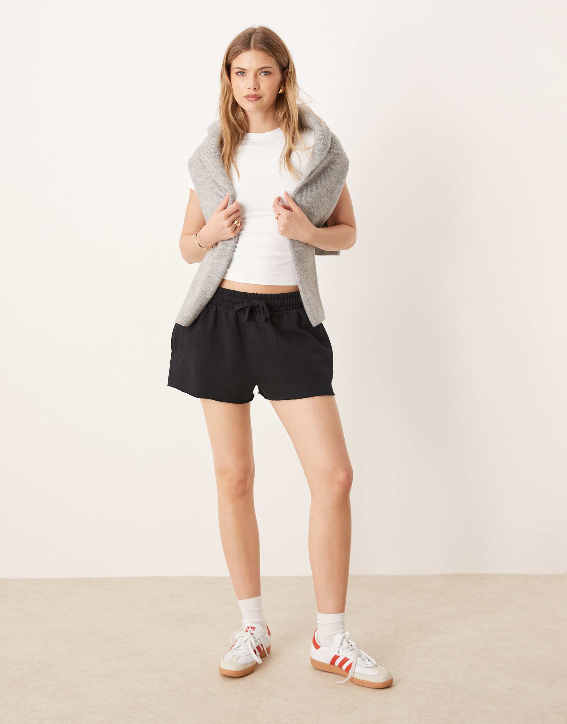 asos design sweatshirt fabric shorts with raw hem detail in black