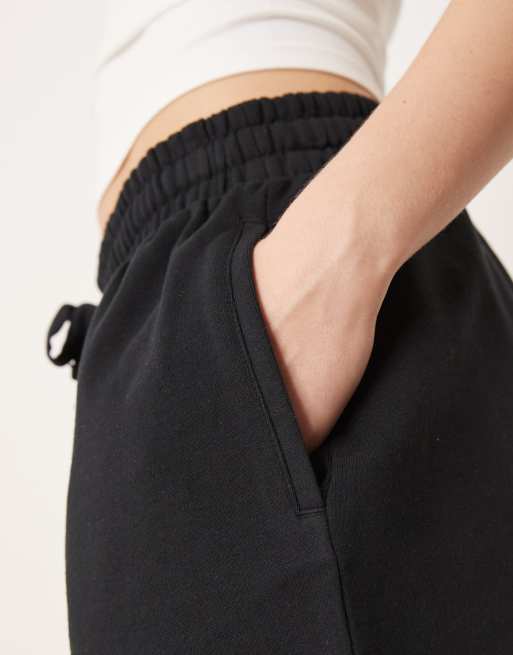 ASOS DESIGN sweatshirt fabric shorts with raw hem detail in black