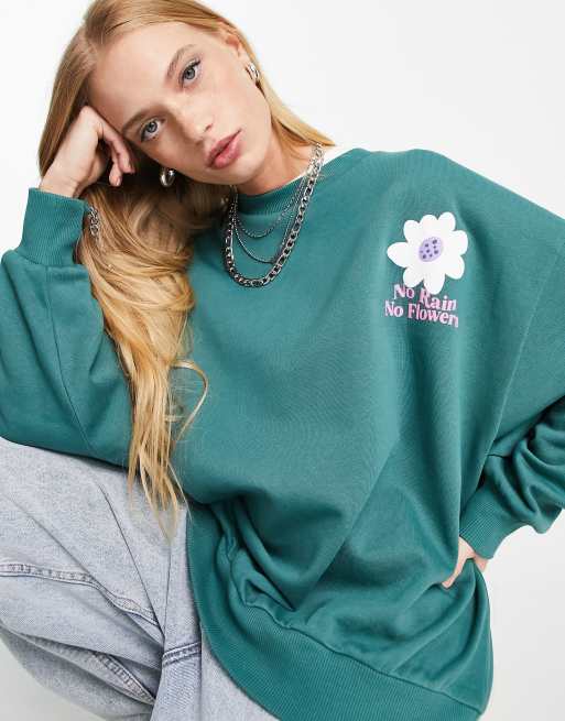 ASOS DESIGN Sweatshirt in Dunkelgrun mit Blumenprint ASOS