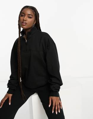 ASOS DESIGN - Sweatshirt in Schwarz mit kurzem Reißverschluss