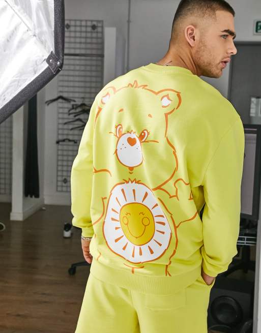 ASOS DESIGN - Sweatshirt met Carebears-print in geel, deel van co-ord set