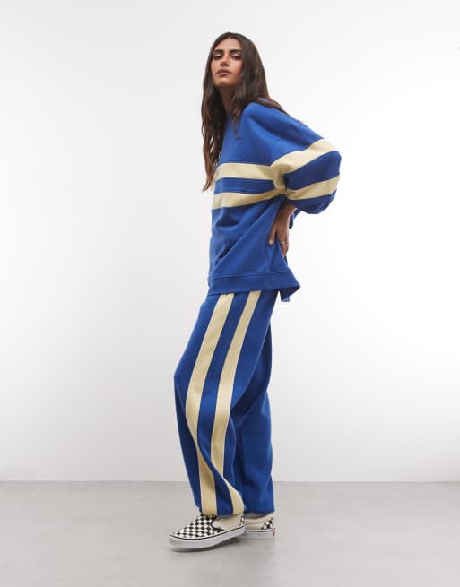 ASOS DESIGN - Co-ord set van sweatshirt en joggingbroek met contrasterende panelen in blauw en geel, 2 van 3