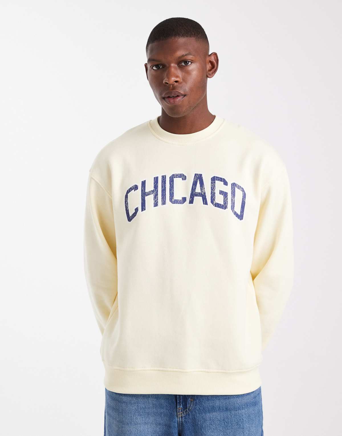 ASOS DESIGN sweatshirt with distressed text embroidery in pale yellow