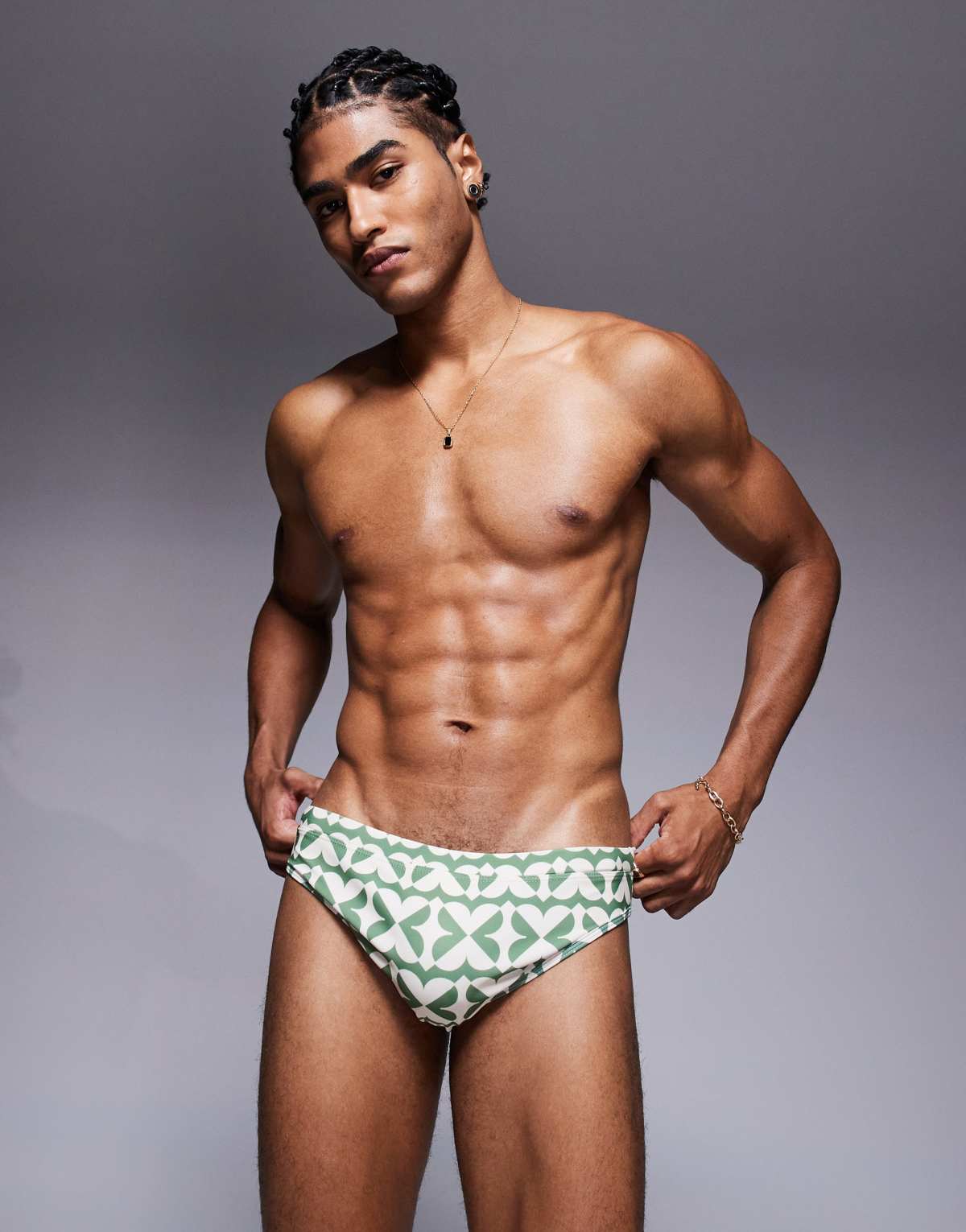 ASOS DESIGN swim brief in green and white geo print