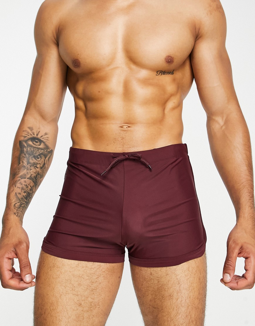 ASOS DESIGN swim brief shorts with curved hem in burgundy-Red