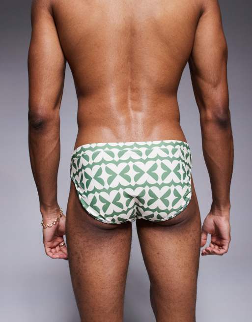ASOS DESIGN swim briefs in green and white geo print
