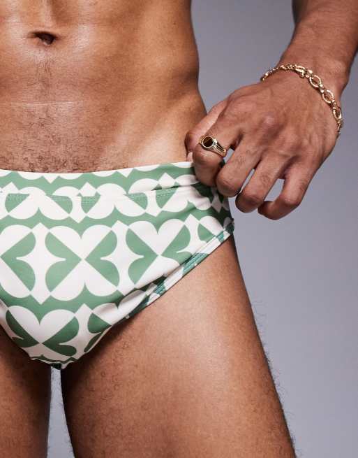 ASOS DESIGN swim briefs in green and white geo print