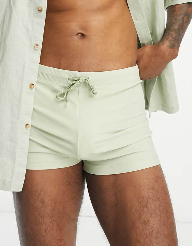 ASOS DESIGN swim briefs in light green