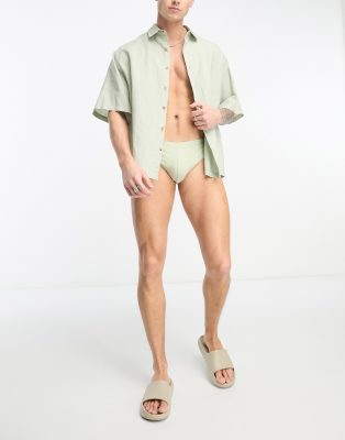 ASOS DESIGN swim briefs in light khaki-Green