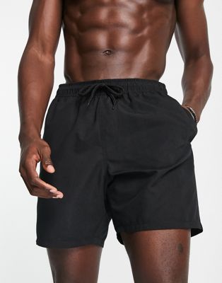 ASOS DESIGN swim shorts in long length in black