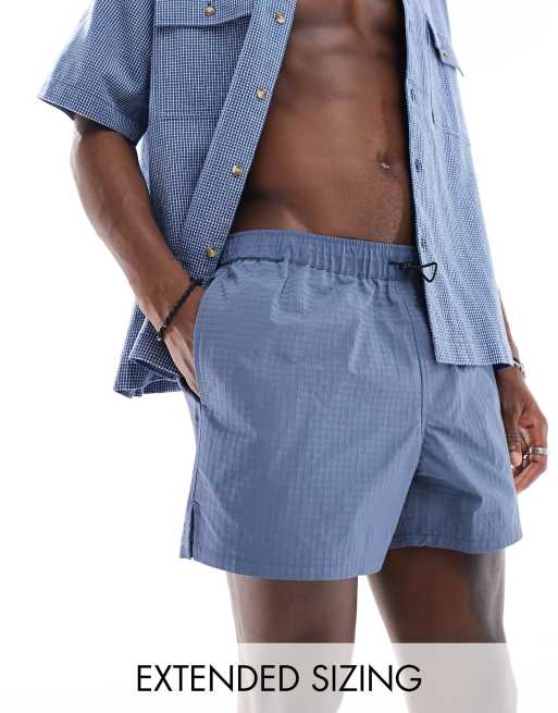 ASOS DESIGN swim short in short length in blue with bungee cord 
