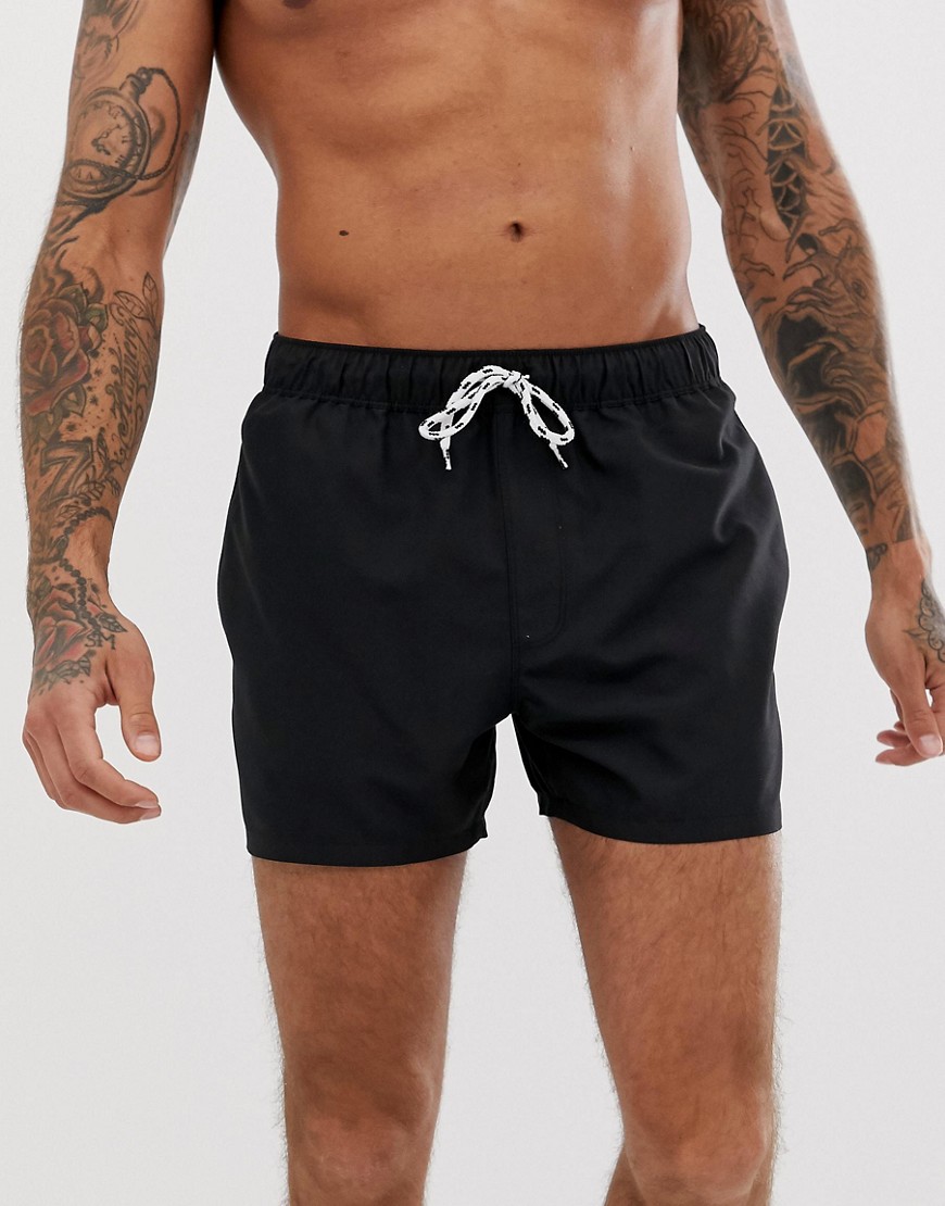 ASOS DESIGN swim shorts in black short length