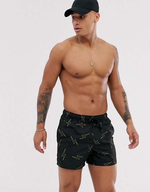 ASOS DESIGN swim shorts in black with lightning bolt print short length