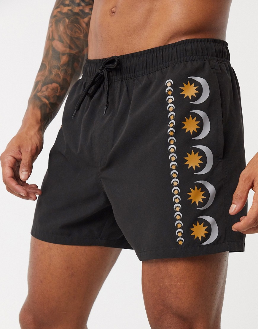 ASOS DESIGN swim shorts in black with side sun prints short length