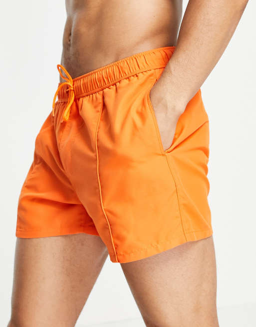 ASOS DESIGN swim shorts in bright orange short length with pin tuck ASOS