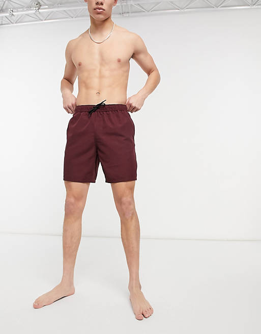 ASOS DESIGN swim shorts in burgundy mid length