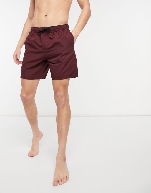 ASOS DESIGN swim shorts in burgundy mid length