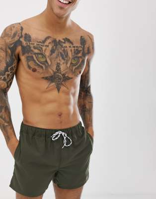 ASOS DESIGN swim shorts in khaki short length with black & white