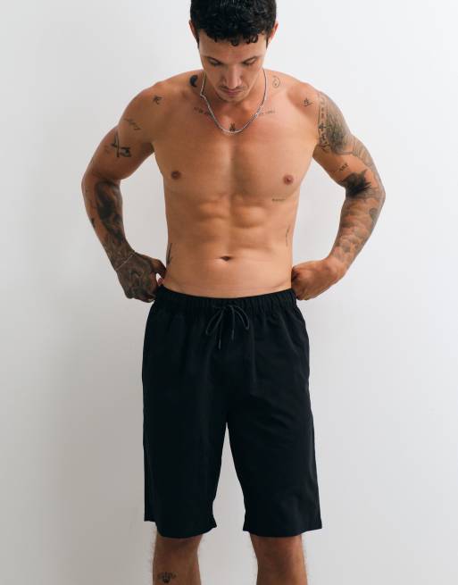 ASOS DESIGN swim shorts in long length in black, 2 of 5