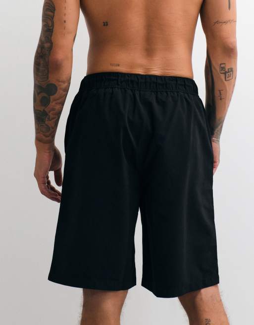 ASOS DESIGN swim shorts in long length in black, 4 of 5