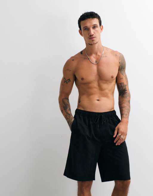 ASOS DESIGN swim shorts in long length in black, 5 of 5