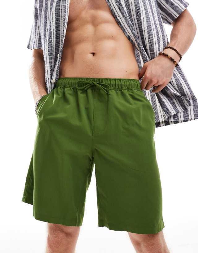 ASOS DESIGN - swim shorts in long length in green