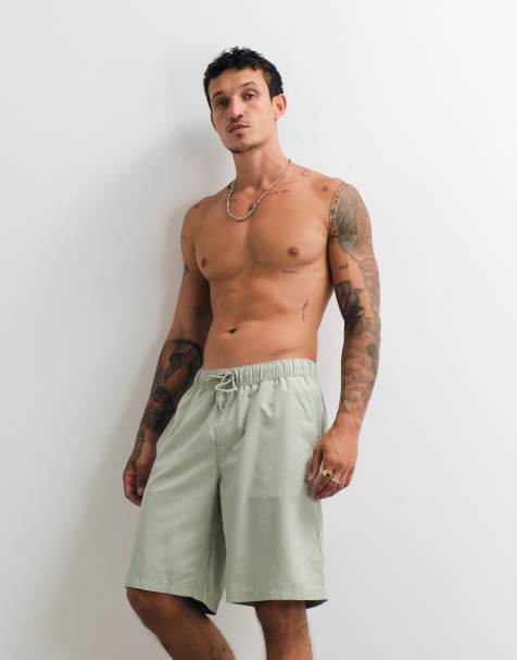 ASOS DESIGN swim shorts in long length in sage green - view 1