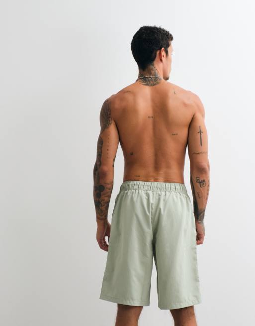 ASOS DESIGN swim shorts in long length in sage green, 3 of 5