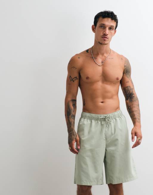 ASOS DESIGN swim shorts in long length in sage green, 5 of 5