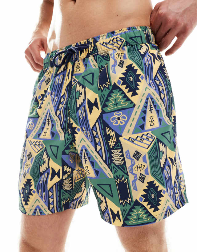 ASOS DESIGN - swim shorts in mid length in abstract print in blue