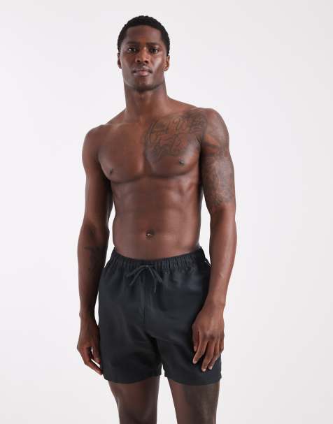 ASOS DESIGN swim shorts in mid length in black with contrast white binding - view 1