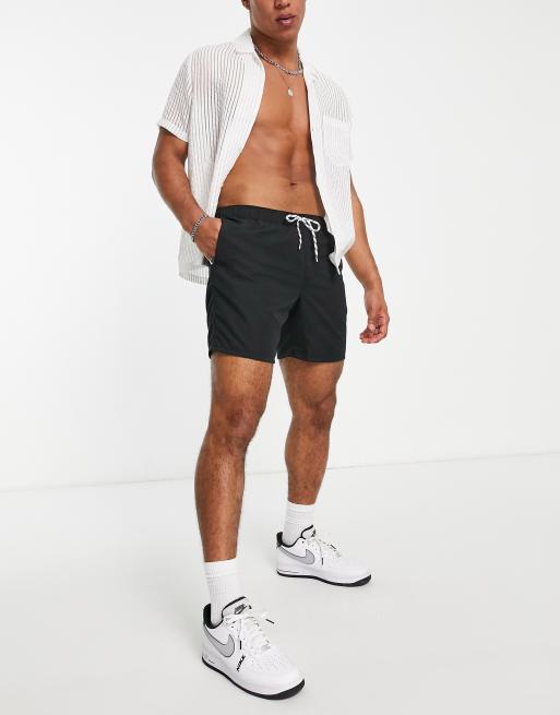 ASOS DESIGN swim shorts in short length in black