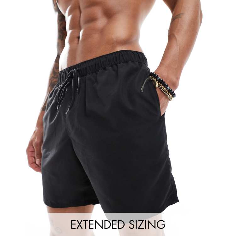 ASOS DESIGN cargo shorts in mid length in black