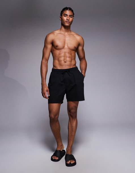 ASOS DESIGN swim shorts in mid length in black - view 2