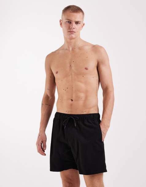 ASOS DESIGN swim shorts in mid length in black - view 1