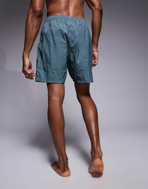 ASOS DESIGN swim shorts in mid length in blue