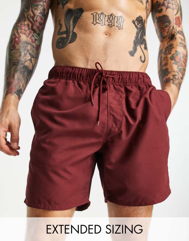 ASOS DESIGN swim shorts in mid length in burgundy