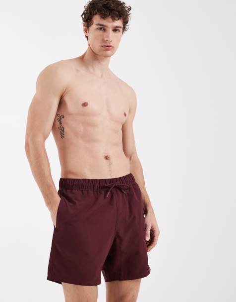 ASOS DESIGN swim shorts in mid length in burgundy - view 1