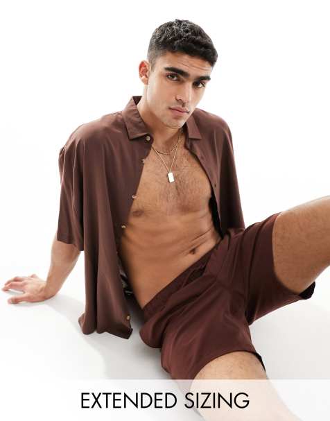 ASOS DESIGN swim shorts in mid length in dark drown - view 1