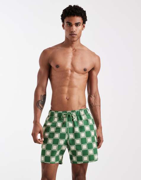 ASOS DESIGN swim shorts in mid length in green checkerboard print - view 1