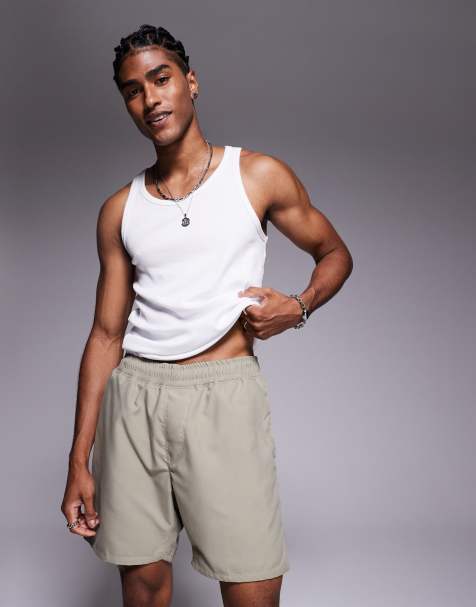 ASOS DESIGN swim shorts in mid length in khaki - view 1