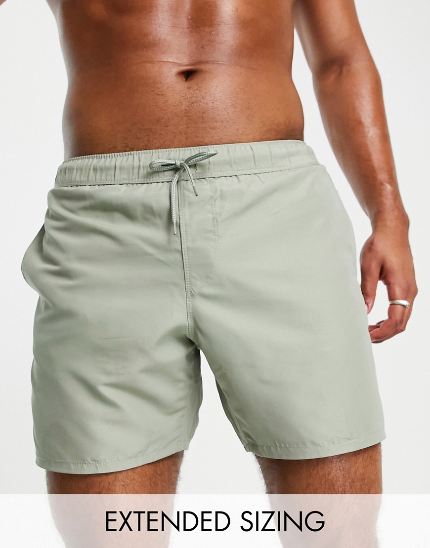ASOS DESIGN swim shorts in mid length in light green
