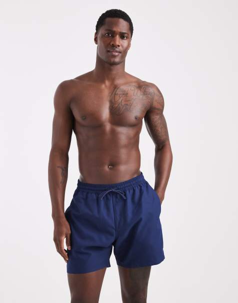 ASOS DESIGN swim shorts in mid length in navy