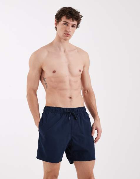 ASOS DESIGN swim shorts in mid length in navy - view 1
