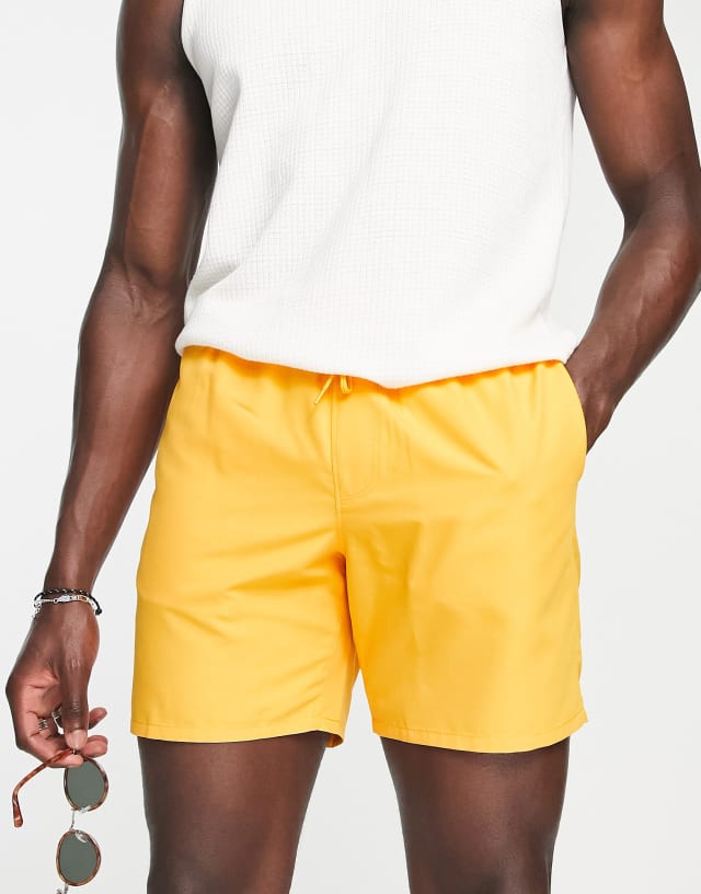 ASOS DESIGN swim shorts in mid length in orange