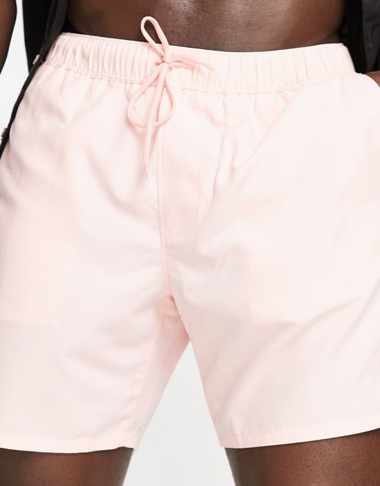 https://images.asos-media.com/products/asos-design-swim-shorts-in-mid-length-in-pastel-pink/201534860-4?$n_550w$&wid=550&fit=constrain