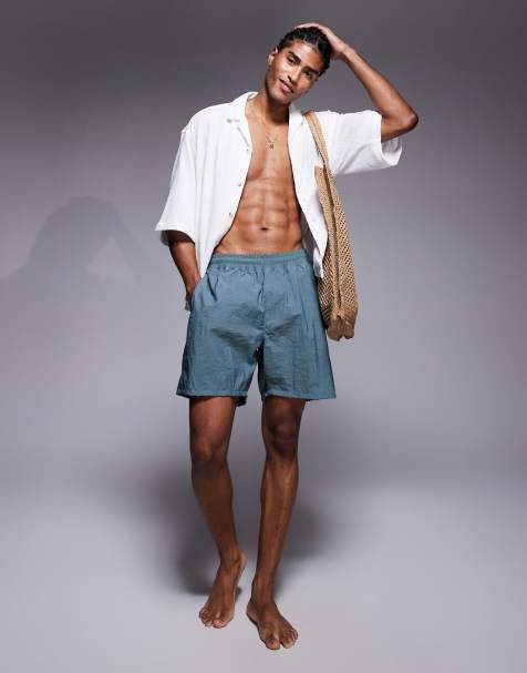ASOS DESIGN swim shorts in mid length in sage stripe - view 1