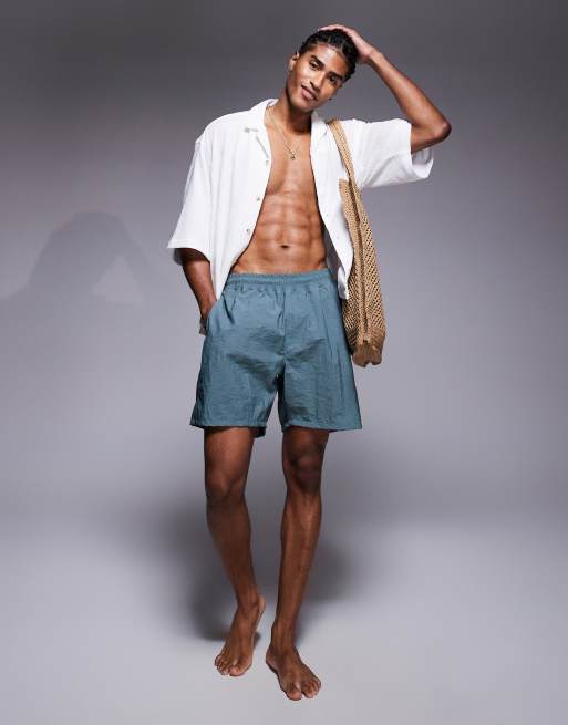 ASOS DESIGN swim shorts in mid length in sage stripe
