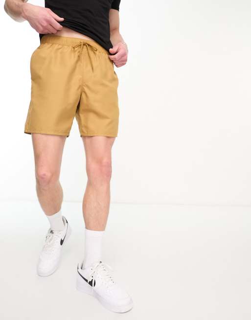 ASOS DESIGN swim shorts in short length with thick waistband in yellow