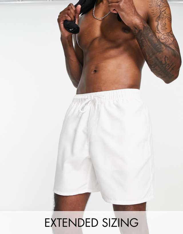 ASOS DESIGN swim shorts in mid length in white